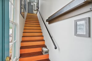 Stairs from the front door up to the 2nd floor unit.