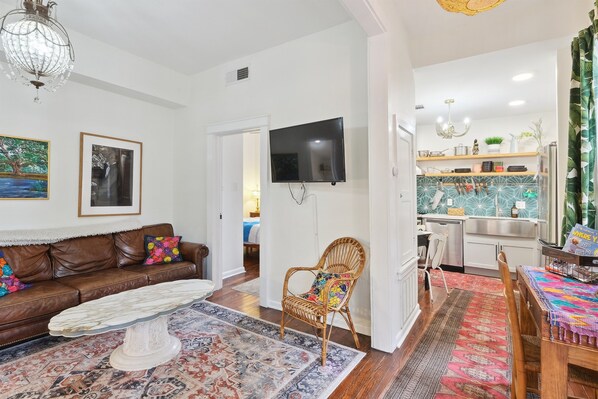 Entry way with living room to left and kitchen to right