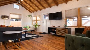 Light-filled living room with TV. Wi-Fi throughout the house.