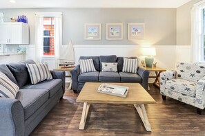 The open concept living, dining and kitchen offers ample room for family gatherings.