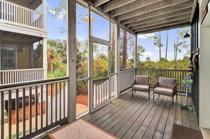 Front screen porch where you enter the property.