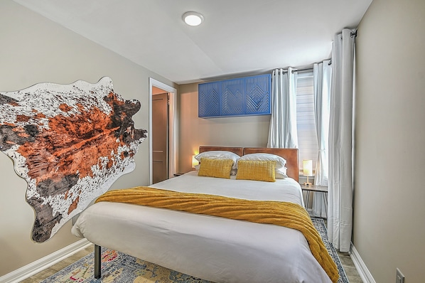 Queen Sized bed with outlets and usb plugs built into the lamps.