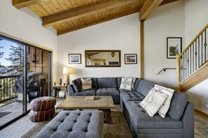 This large sectional faces the wooded views.