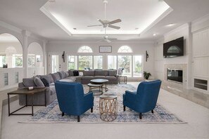 Large livingroom with an abundance of natural light (not to mention plenty of seating for the entire family)