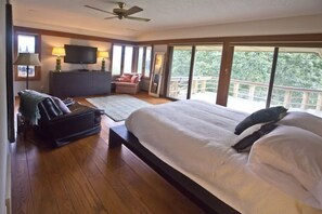 Master bedroom with queen bed with access to deck