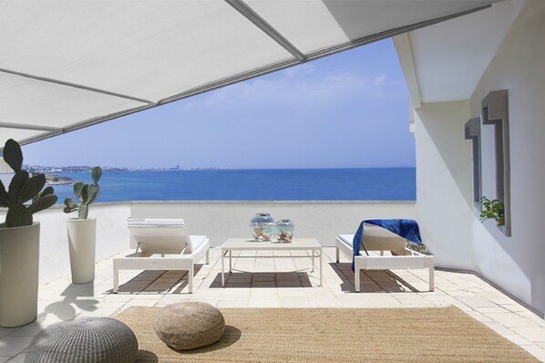 The suite's private landscaped sun terrace overlooking the sea 