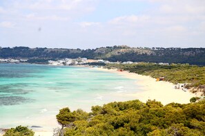 A panoramic view of the sandy beach Rivabella Padula Bianca 