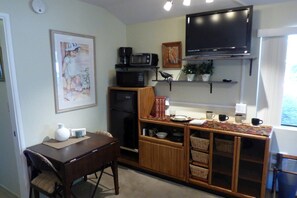 Kitchenette with refrigerator/freezer, microwave, toaster oven, and Dish TV 