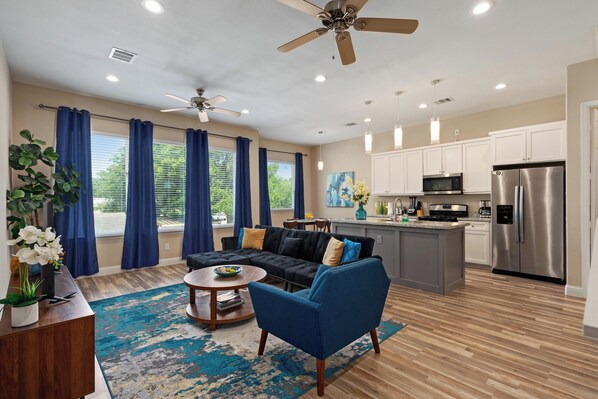 Open living and kitchen area. This is the view at the top of the stairs.