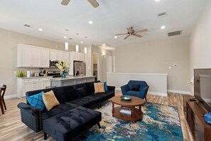 Open living area including double-twin convertible sofa.