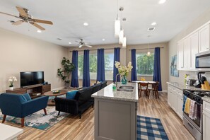 Open living, kitchen and dining area on the second floor.