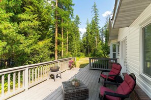 View from the deck, surrounded by tall pines.