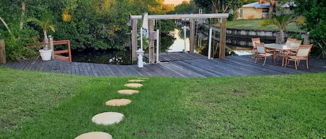 Backyard with boat lift set up for kayak launching