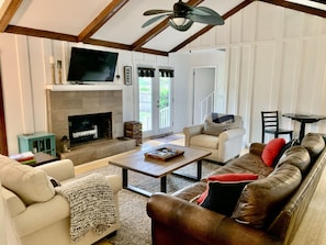 Living room with comfortable seating and Roku-equipped TV