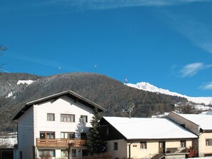 Sky, Cloud, Building, Mountain, Window, Snow, Slope, House, Tree, Mountainous Landforms