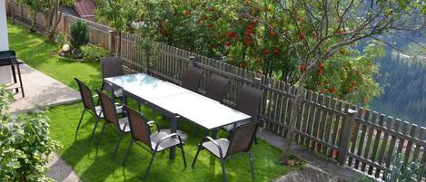 Plant, Flower, Table, Property, Furniture, Building, Tree, Outdoor Furniture, Outdoor Table, Shade