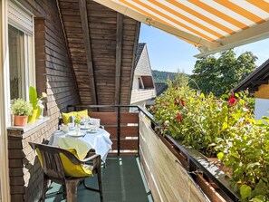 Wood, Home, Awning, Outdoor Furniture, Siding, Outdoor Table, Chair, Shade, Balcony, Cottage