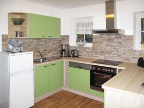 Countertop, Room, Kitchen, Cabinetry, Furniture, Property, Interior Design, Floor, Tile, Yellow
