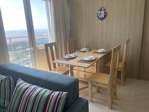 Dining area. Sits 4. Plates and utensils are provided.
