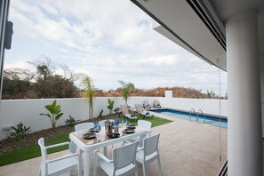 Outside dining area with table and chairs for 6 persons