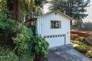 Surrounded by evergreens in this mid-Century modern home. - Surrounded by evergreens in this mid-Century modern home.