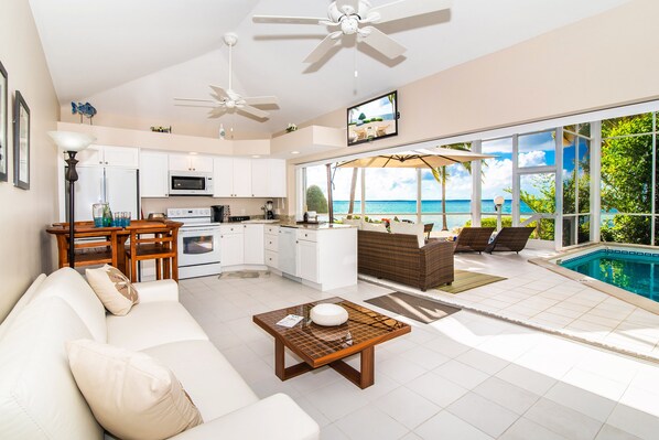 Step into bliss with a living room featuring stunning ocean views.