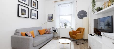 This inviting living room will be waiting for you after a busy day exploring the city. 