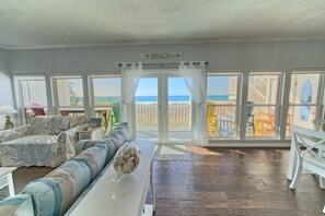 Bright and breezy, this living space invites you to relax with panoramic ocean views just steps away