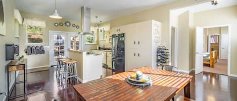 This spacious kitchen is well equipped cooking and gathering. 