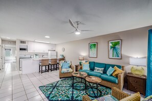 Bright and cheery living room with full murphy bed and AC.