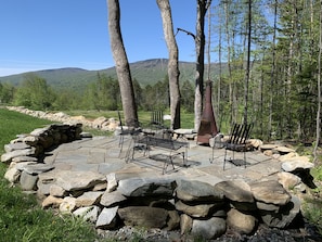Fire pit seating area beside seasonal stream