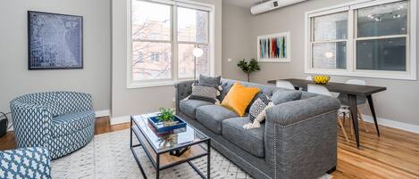 Living Area & Dining Area. Pull out couch w/ queen memory foam mattress. 