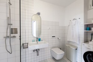 Private bathroom with shower, wash basin and toilet