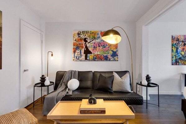 Living Room: Features 1 sofa bed and a Smart HD TV. Log in to your favorite streaming services like Netflix, Disney+, and Prime.
