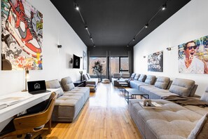 Living Room #1: Features 8 luxurious, brand-new full sofa beds, perfect for lounge group seating and providing ample sleeping space. Includes a Smart HD TV with Netflix, YouTube, and Prime Video.