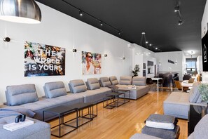 Living Room #1: Features 8 luxurious, brand-new full sofa beds, perfect for lounge group seating and providing ample sleeping space. Includes a Smart HD TV with Netflix, YouTube, and Prime Video.