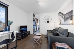 Living Room: Features a sofa bed, Smart HD TV with Netflix, YouTube, and Prime.