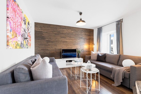 Living Room: Features 2 queen-size sofa beds, 1 queen air mattress, and a Smart HD TV. Log in to your favorite streaming services like Netflix, YouTube, and Prime Video.
