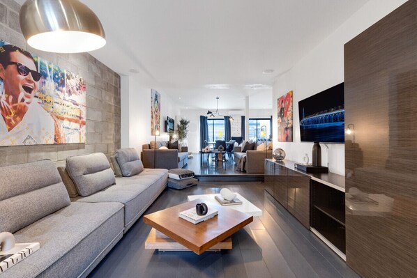Living Room #1: Brand new, features 2 full-size sofa beds with a vintage Art Deco look from the '70s, and a Smart HD TV with Netflix, YouTube, and Prime, perfect for extra sleeping space.
