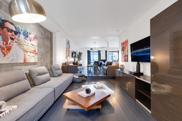 Living Room #1: Brand new, features 2 full-size sofa beds with a vintage Art Deco look from the '70s, and a Smart HD TV with Netflix, YouTube, and Prime, perfect for extra sleeping space.