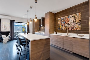 Kitchen: Brand new, super big and luxurious chef's kitchen, fully equipped with a big island and chairs for entertaining, a Smart TV, a wine cellar, and complete with complimentary coffee and tea.