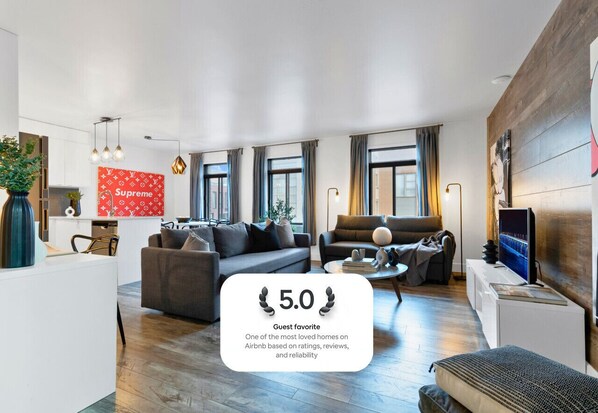 Living Room: Features 2 queen-size sofa beds with Art Deco, and a Smart HD TV with Netflix, YouTube, and Prime.