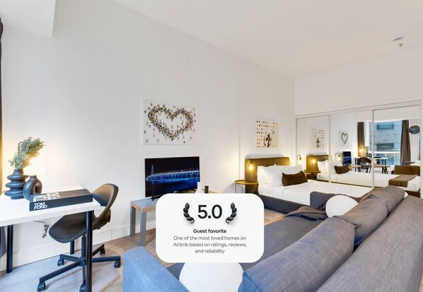Living Room: Features 1 sofa bed, 1 queen-size bed with memory foam, Smart HD TV with Netflix, YouTube, and Prime.