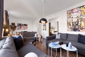 Living Room: Features 3 sofa beds and a Smart HD TV. Log in to your favorite streaming services like Netflix, Disney+, and Prime.
