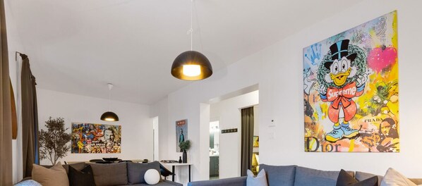 Living Room: Features 3 sofa beds and a Smart HD TV. Log in to your favorite streaming services like Netflix, Disney+, and Prime.