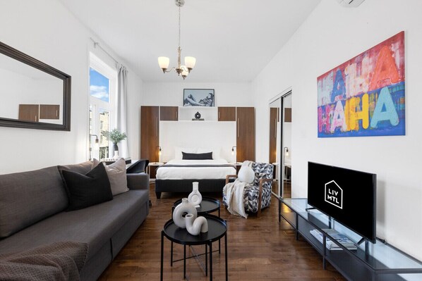 Living Room: Features 1 sofa bed, 1 queen-size bed with memory foam, Smart HD TV with Netflix, YouTube, and Prime.
