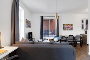 Living Room: Features 1 sofa bed, memory foam, and a Smart HD TV with Netflix, YouTube, and Prime.