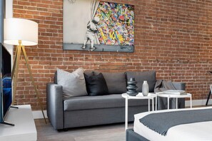 Living Room: Features 1 sofa bed, 1 queen-size bed with memory foam, Smart HD TV with Netflix, YouTube, and Prime.