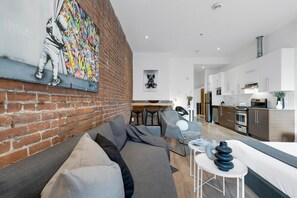 Living Room: Features 1 sofa bed, 1 queen-size bed with memory foam, Smart HD TV with Netflix, YouTube, and Prime.