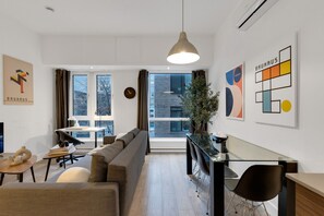 Living Room: Features a sofa beds and a Smart HD TV. Log in to your favorite streaming services like Netflix, Disney+, and Prime.